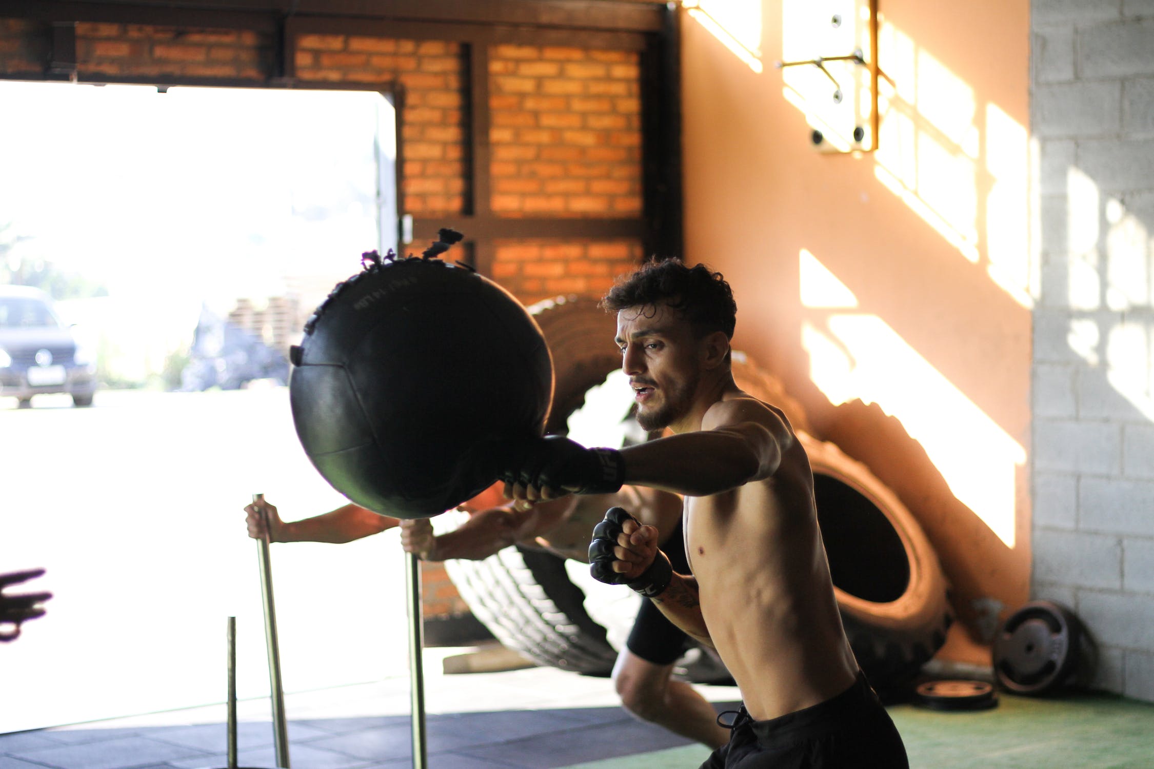 mma-fighter-hitting-medicine-ball